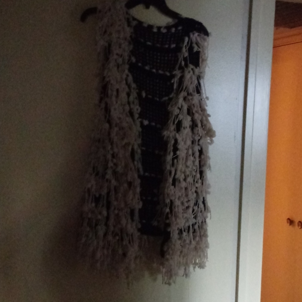 Fun 70's style vest. Great with jeans!